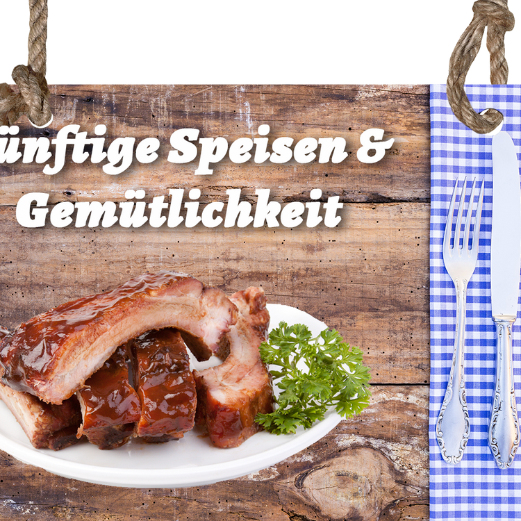 Holzbrett mit Aufschrift und Spareribs